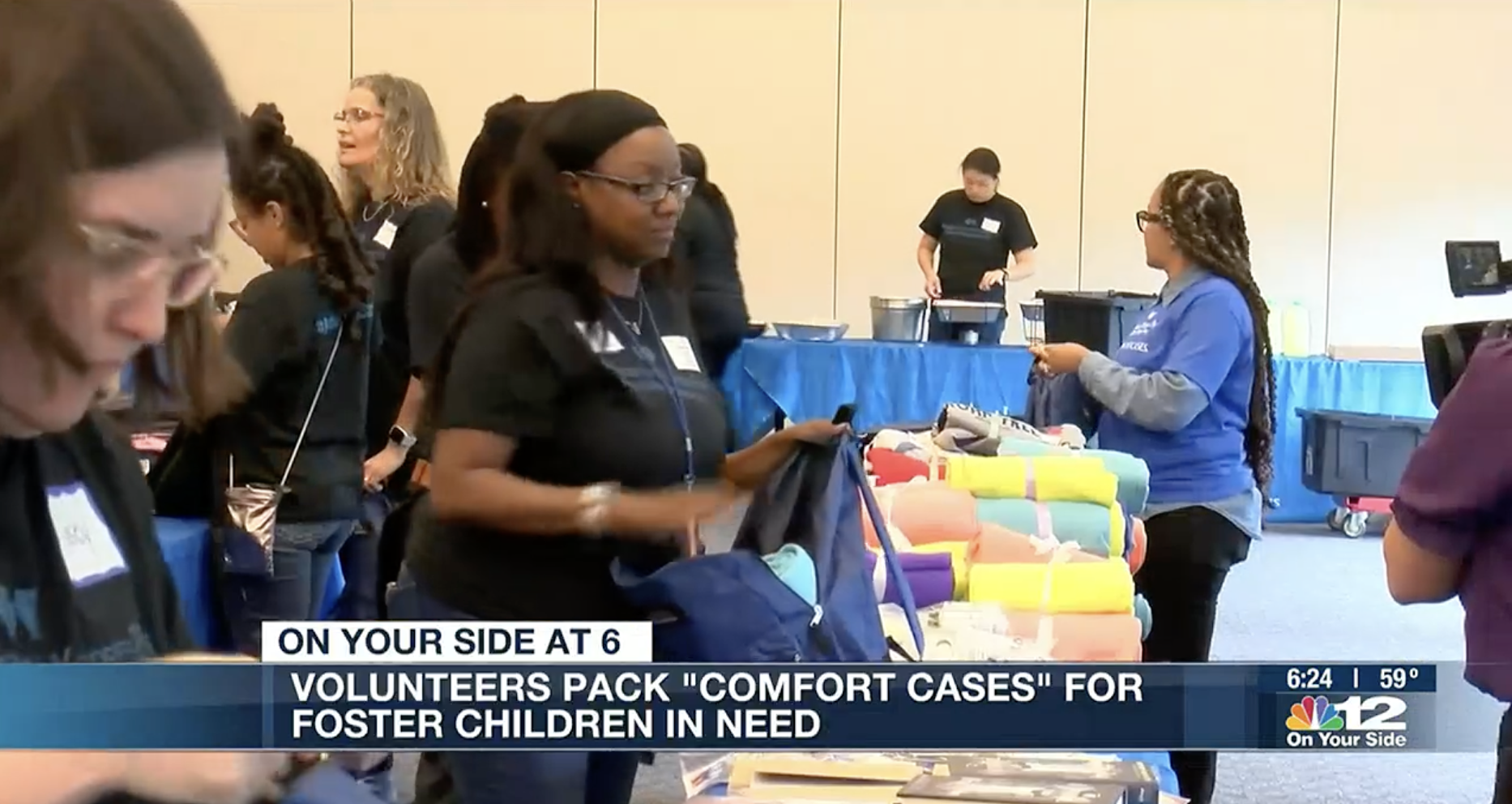 Volunteers pack "Comfort Cases" for foster children in need